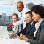 Portrait of a happy group of business executives working in an office